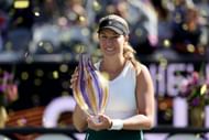 Danielle Collins posing with the 2024 Charleston Open trophy